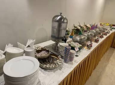 Birthday catering table with snacks and decor by Little Jalebis